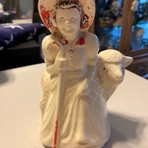 Vintage planter. Lady with sheep. Alot of color has come off